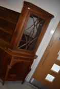 An Edwardian mahogany and inlaid corner display on stand having shell design inlay to under shelf,