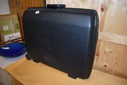 A hard bodied Samsonite suitcase