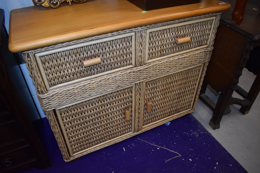 A modern beech and wicker effect sideboard, approx. dimensions W100 D45 H81cm