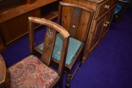 A set of four mid 20th Century oak dining chairs