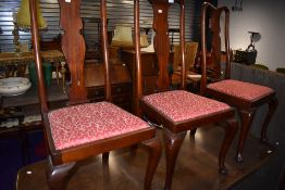A set of three mahogany dining chairs with cabriole legs and vase back