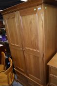 A nice quality modern pine wardrobe having two over one drawer base, width approx. 103cm, height