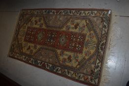 A tradition Persian style rug, approx. 140 x 82cm
