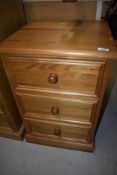 A modern pine bedside chest of three drawers, nice quality with tongue and groove drawer bottoms