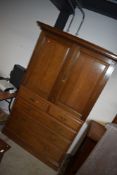 A late Victorian oak linen press, comprising double cupboard over two over three drawer base,