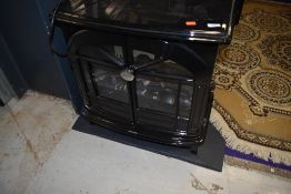 A Dimplex electric wood effect stove, on slate base