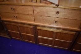 A Nathan teak short sideboard of two over two drawers over double cupboard, width approx. 102cm