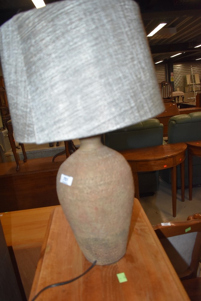 A pottery table lamp, with complimentary shade