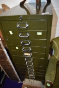 A set of vintage metal filing drawers , in Khaki green, labelled Stor