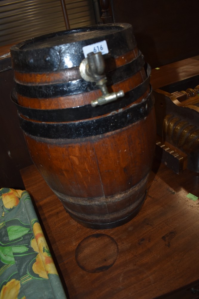 A vintage oak barrel of small proportions, with metal bindings, approx height 40cm