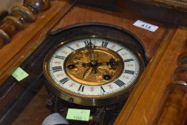 An early 20th Century bleached mahogany Vienna wall clock, having interesting brass butterfly dial ,