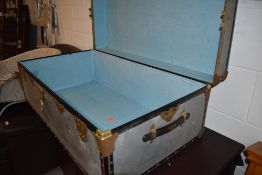 A vintage aluminium travel chest