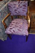 An early 20th Century stained frame carver chair having later plum upholstery to seat and back