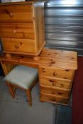 A modern small dressing table, stool and three drawer bedside chest