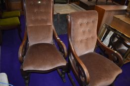 A ladies and gents pair of Victorian mahogany scroll frame rocking chairs having later dralon button