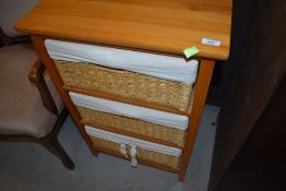 A modern pine and basket unit, approx. width 51cm