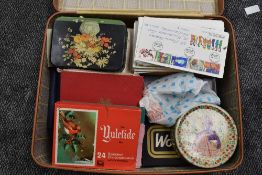 A suitcase of Stamps, UK & World, On and off paper, loose and in albums along with First Day