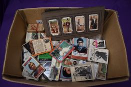 A box of Cigarette and Trade Cards including A & BC Gum, Topps Superman, Footballers,Typhoo etc