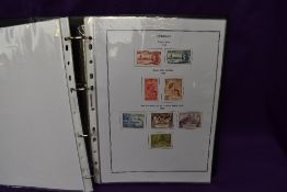 An album of Dominica Stamps, mainly mint, Queen Victoria - 1979, mainly George V & Queen Elizabeth