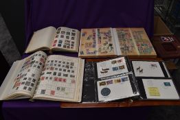 Three albums of Commonwealth and World Stamps, mint & used, 20th century onwards along with an a