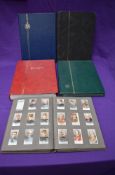 Four modern empty Stock Books along with a Cigarette Card Albums with two sets of cards