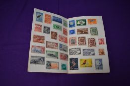 A Booklet of Commonwealth Stamps, mint & used, hinged, including Queen Victoria South Australia Nine