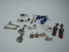 Several pairs of silver and white metal earrings for pierced ears, including two pairs by Kit Heath,
