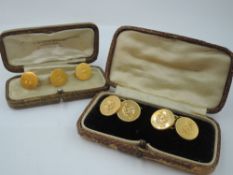 A set of four yellow metal dress shirt buttons with rings stamped 22C and bearing monograms and