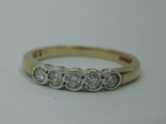 A five diamond dress ring, total approx 0.25ct in collared mounts on a 9ct gold loop, size M & 2.1g