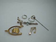 A selection of yellow metal, some stamped 375/9ct including pin brooch, bar brooch, musical notes