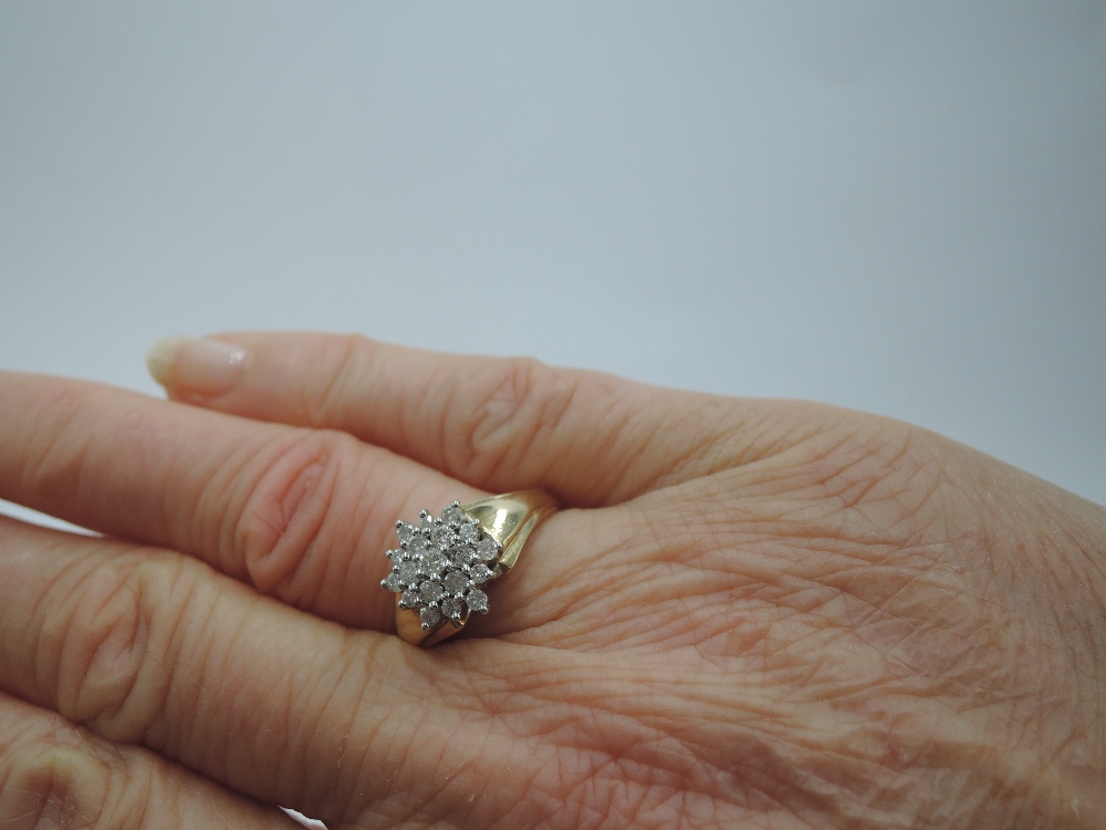 A lady's dress ring having a diamond chip triple cluster in a stepped mount to shaped shoulders on a - Image 2 of 2