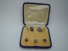 A cased set of dress shirt hematite and rose metal cufflinks with matching trio of collar studs