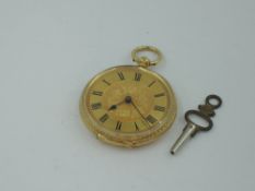 A Victorian yellow metal key wound pocket watch stamped 18K of small form, having Roman numeral dial