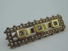 A Victorian yellow metal brooch of rectangular form having diamond and seed pearl decoration, no