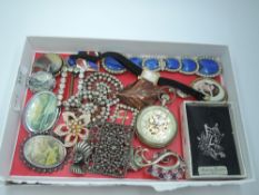 A selection of vintage costume jewellery including buckles, brooches, wrist watch, etc