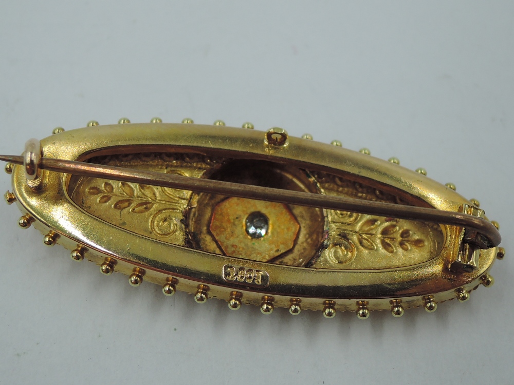 A Victorian yellow metal brooch stamped 15ct having a central old cut diamond, approx 0.064ct in a - Image 2 of 3