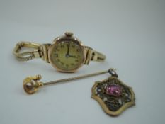 A lady's vintage 9ct gold wrist watch having Arabic numeral dial in gold case on a rolled gold