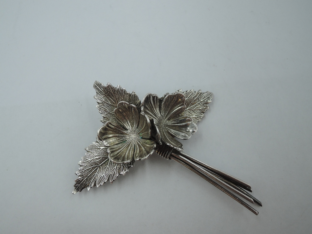 An HM silver brooch modelled as a tied posy, bearing marks CH probably Charles Horner