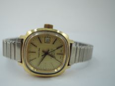 A lady's 1980's Mappin & Webb automatic wrist watch having baton numeral dial with date aperture and