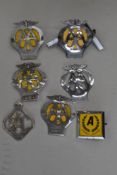 A selection of AA motor car hood or grill badges including 2B 5C and 02 also later Automobile