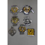 A selection of AA motor car hood or grill badges including 2B 5C and 02 also later Automobile