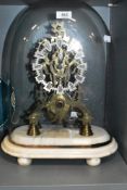 An impressive antique glass domed skeleton clock having fusee movement and carved marble base