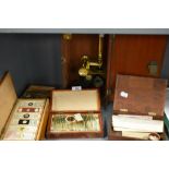 A fine selection of antique scientific microscopes and labeled slide sets natural history related