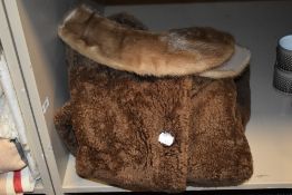 A vintage sheepskin coat and a mink tippet.