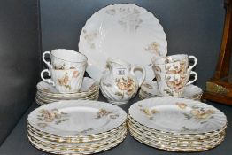 A part tea service by Aynsley having scalloped design