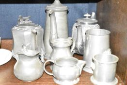 A selection of pewter wares including tea and chocolate pot also mugs etc