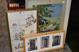 Two framed needlepoint pictures and another framed photograph or Portuguese door interest.