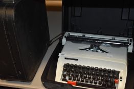 Two retro typewriters, an Erika and a Hermes 305.