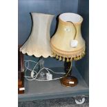 A pressed glass lamp base and similar wooden example with period shades
