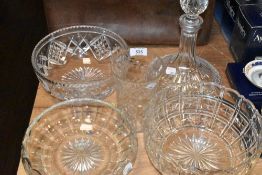 Three glass fruit bowls,a decanter and a vase.